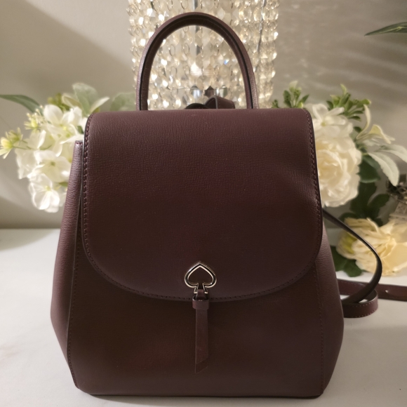 kate spade Handbags - kate spade Burgundy Leather Mini Backpack with Heart Clasp